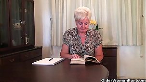 Chubby granny in stockings plays with vibrator